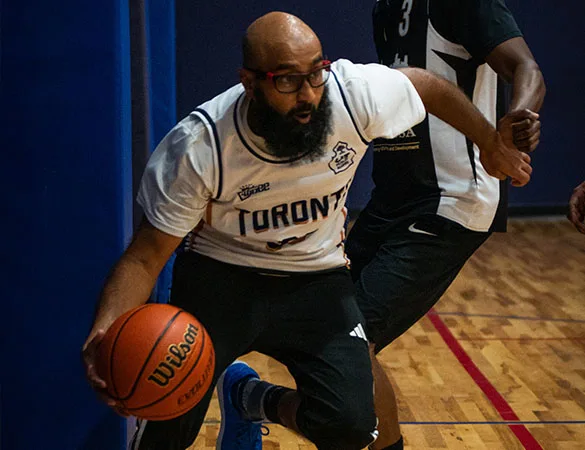 basketball player driving to the basket in a tournament